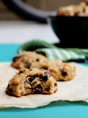 A cookie with a bite taken out of it to reveal the soft and chewy middle.