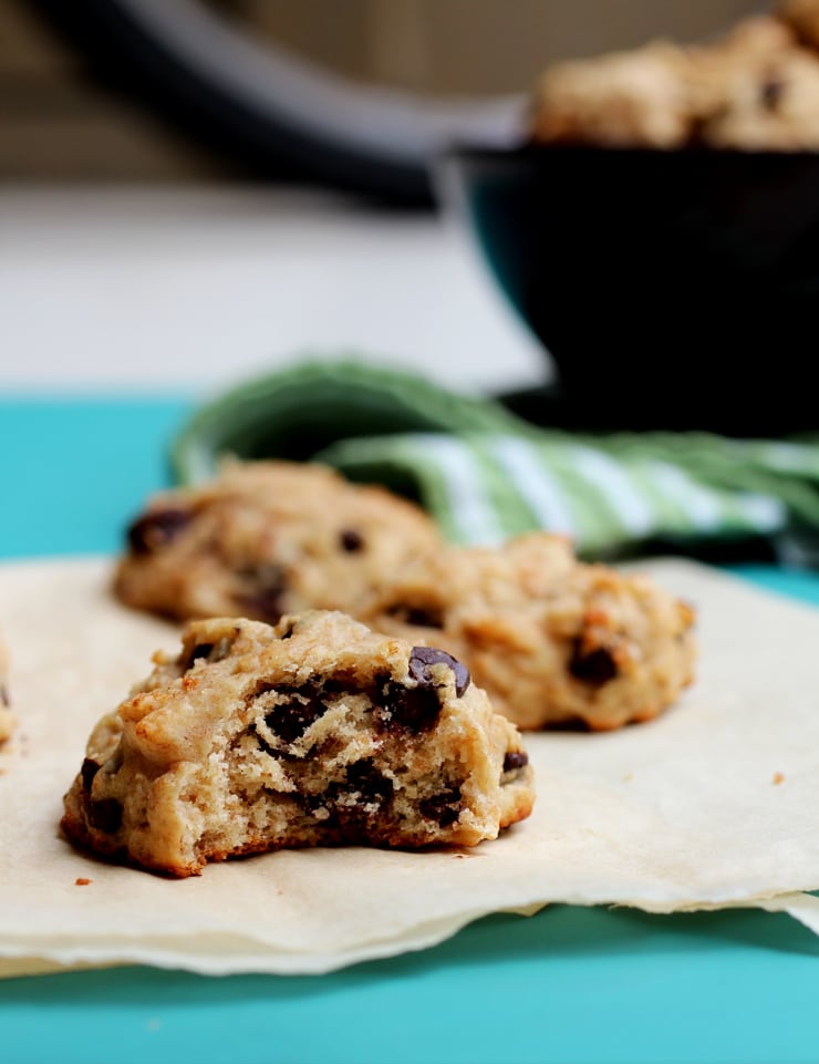 A cookie with a bite taken out of it to reveal the soft and chewy middle.