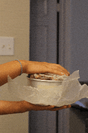 A gif of unmolding a Milk Bar cake from a 6-inch cake pan.