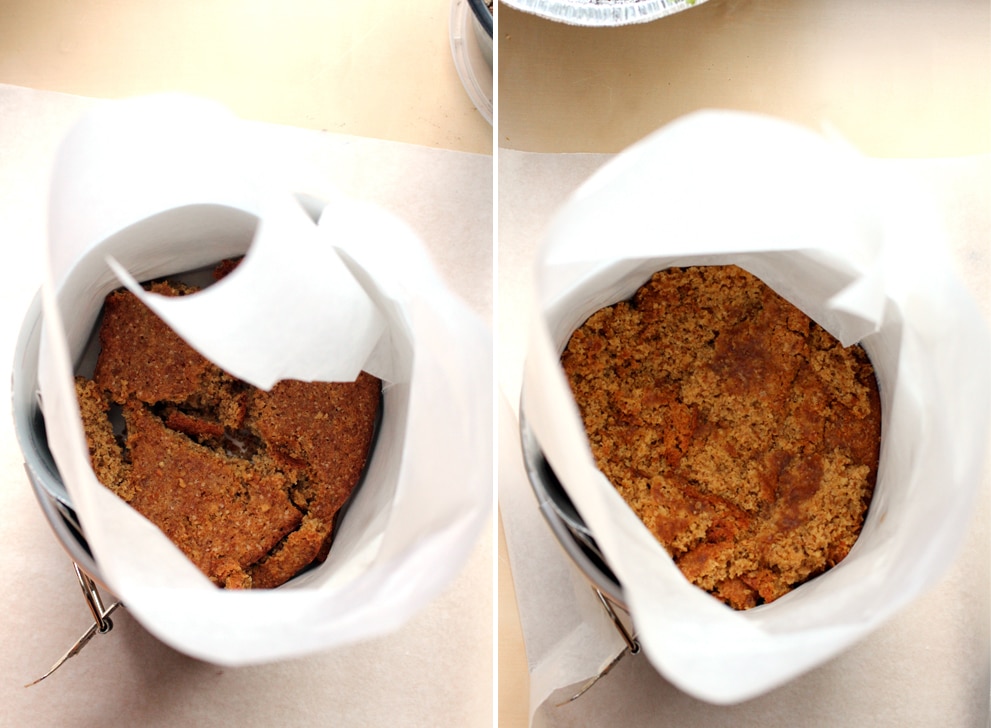 A 6-inch cake pan lined with parchment paper and chunks of cake lining the bottom.