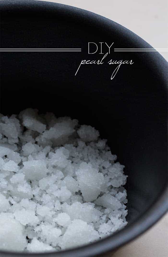 A black saucepan full of crystallized pearl sugar.
