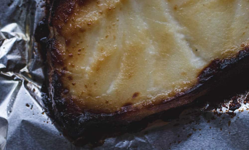 A close up on miso glazed cod to see the flaky texture.
