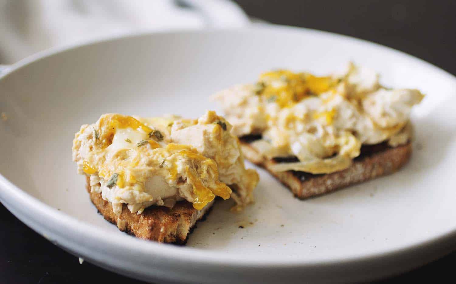 Two slices of bread topped with tofu oyakodon.