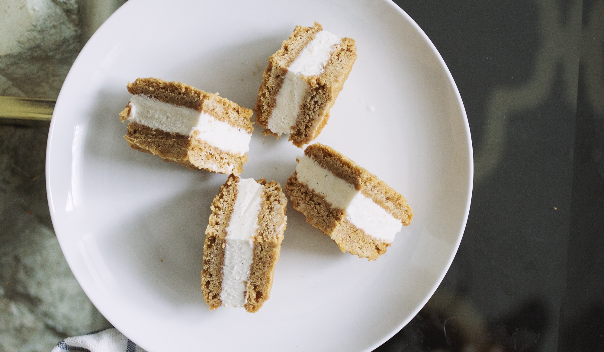 A quartered Wowbutter ice cream sandwich on a white plate.