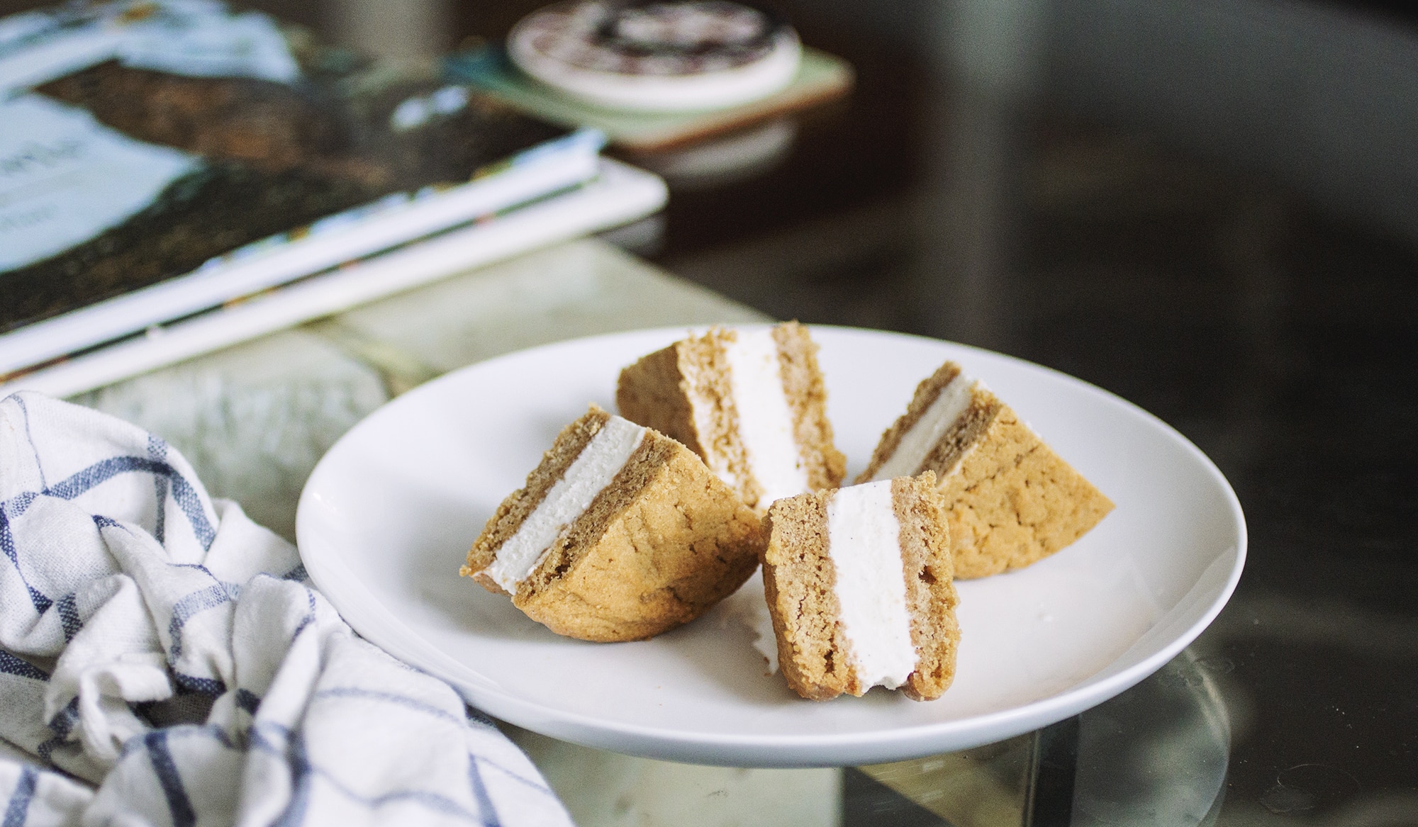 A quartered wowbutter ice cream sandwich on a white plate.