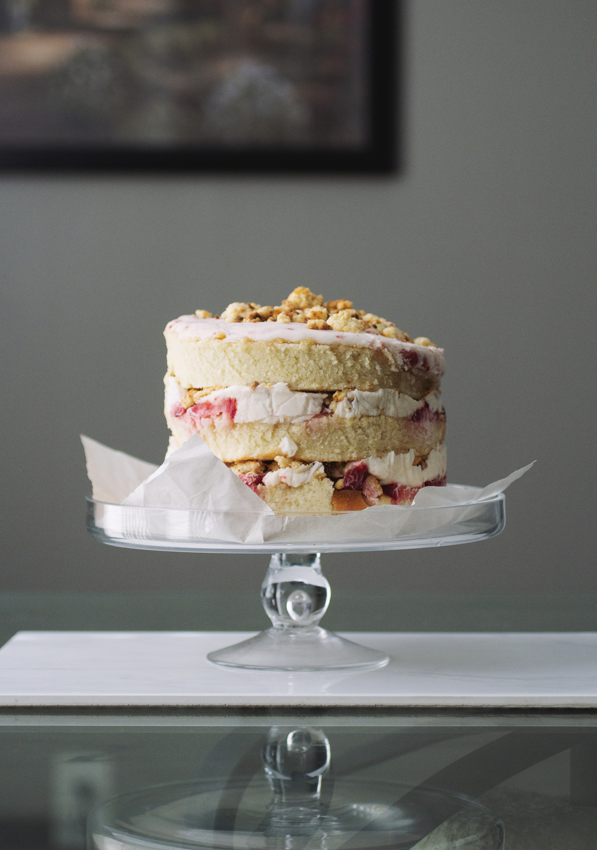 A triple layer strawberry cake with milk crumbs.