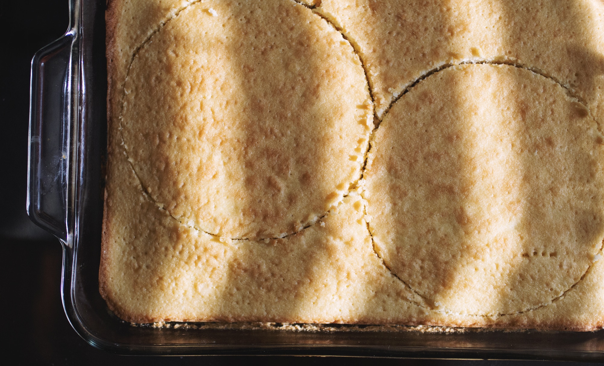 Two 6-inch rings stamped out of a sheet of vanilla cake.