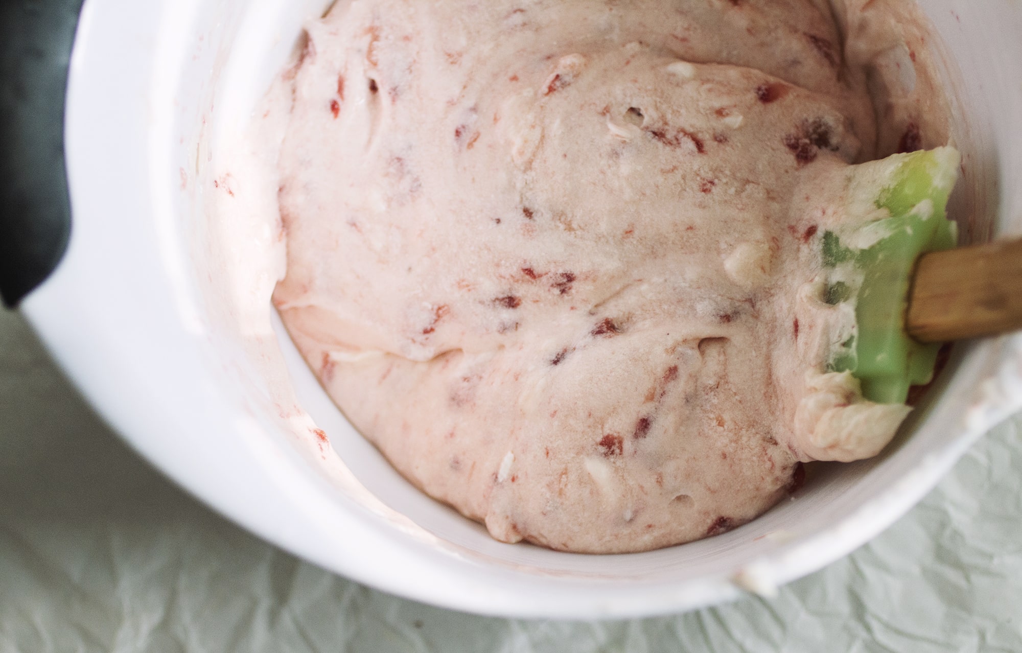 A bowl of strawberry frosting.
