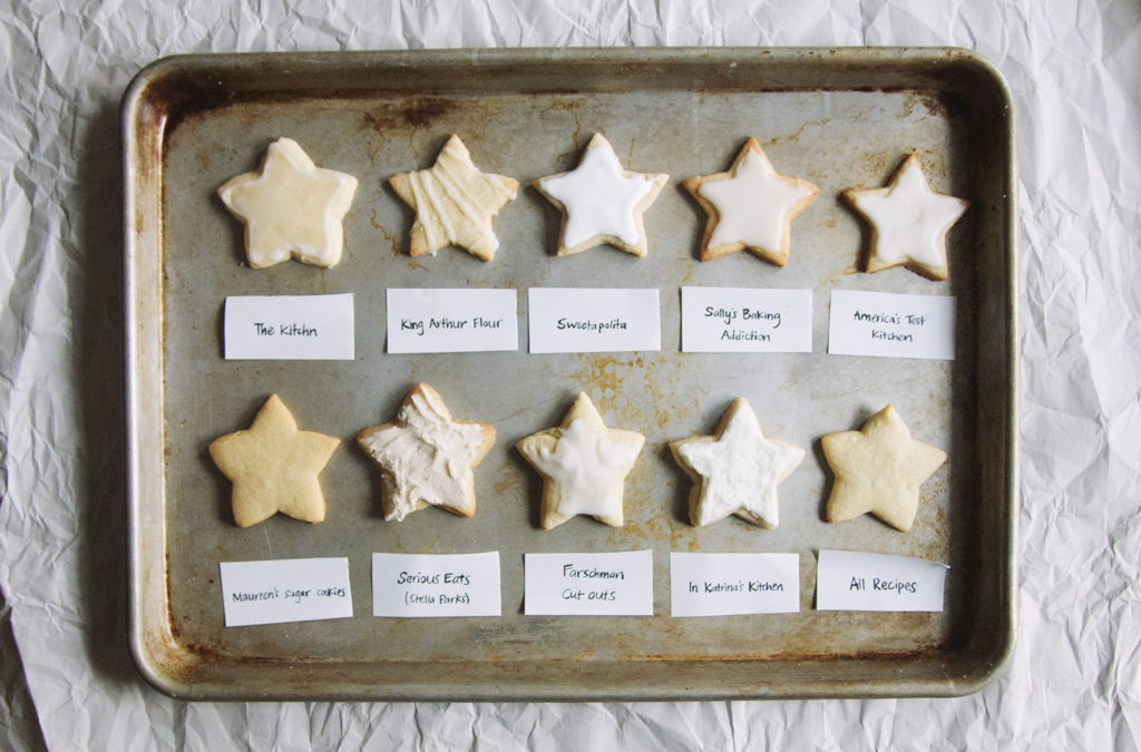 10 different sugar cookies on a baking tray.