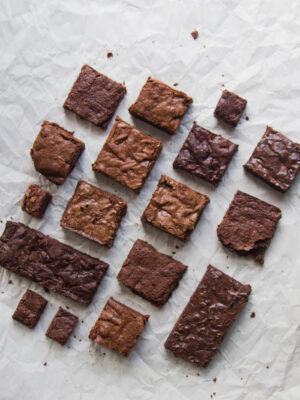 Squares of brownies on a gray background.
