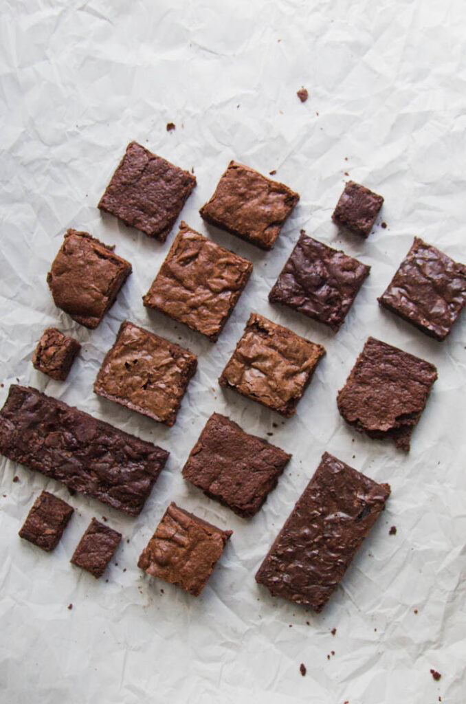 Squares of brownies on a gray background.