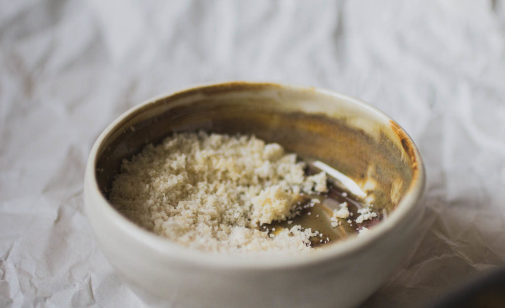 A ceramic container with almond flour.