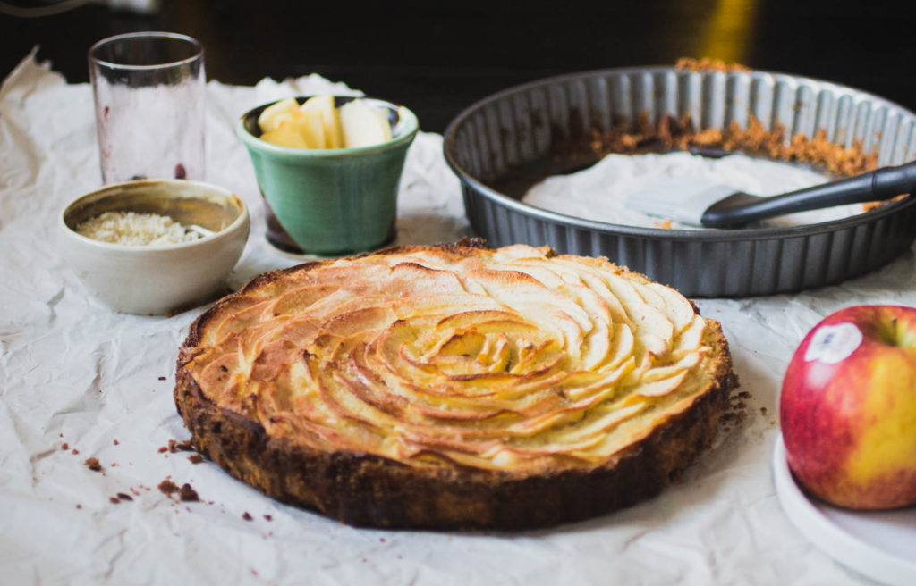 An apple tart with a spiral of apple slices.