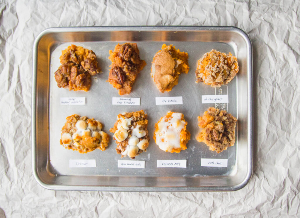 8 scoops of different sweet potato casseroles on a silver tray.