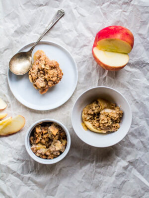 Three bowls filled with different apple crisps.