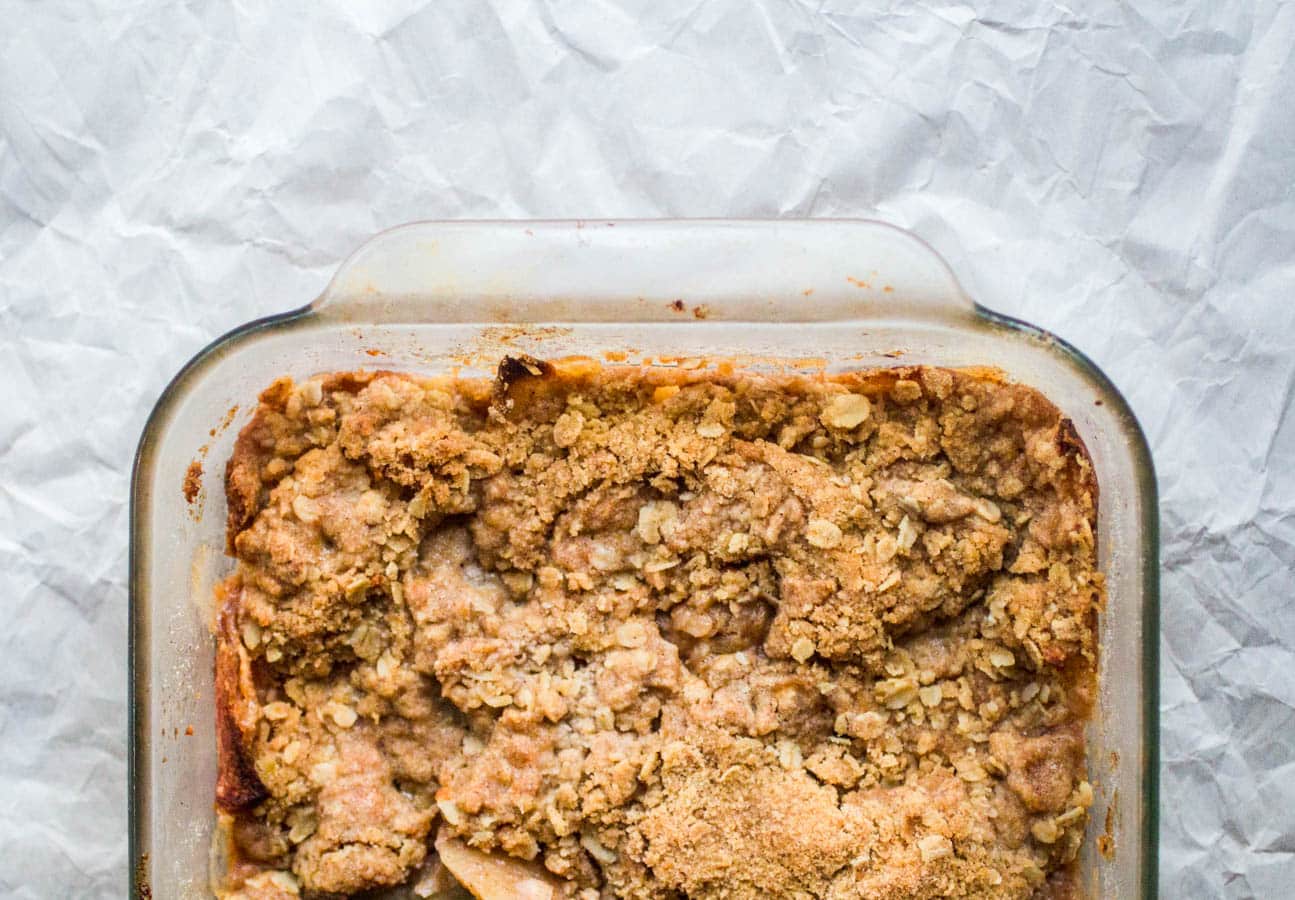 A glass pan filled with apple crisp.