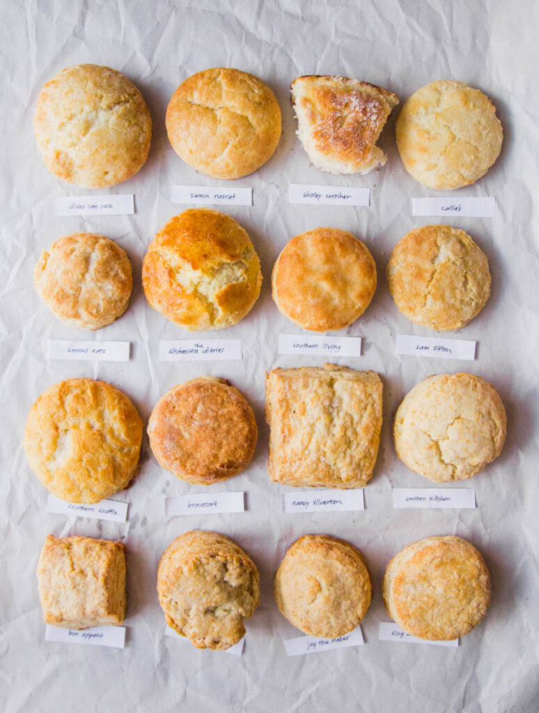 16 biscuits lined in rows of 4 up on white parchment paper.