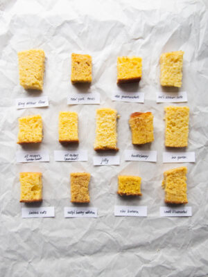 13 different cornbread slices on a gray background.
