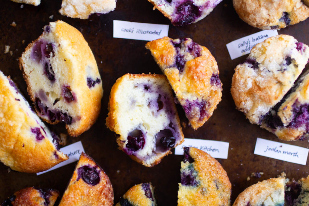 Overhead view of several blueberry muffins cut in half.