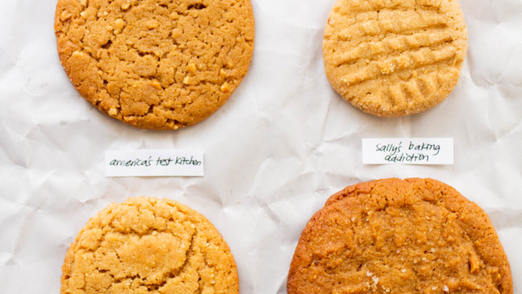 Close up on four peanut butter cookies.