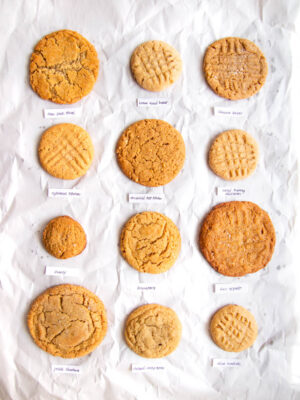 12 different peanut butter cookies on a gray background.