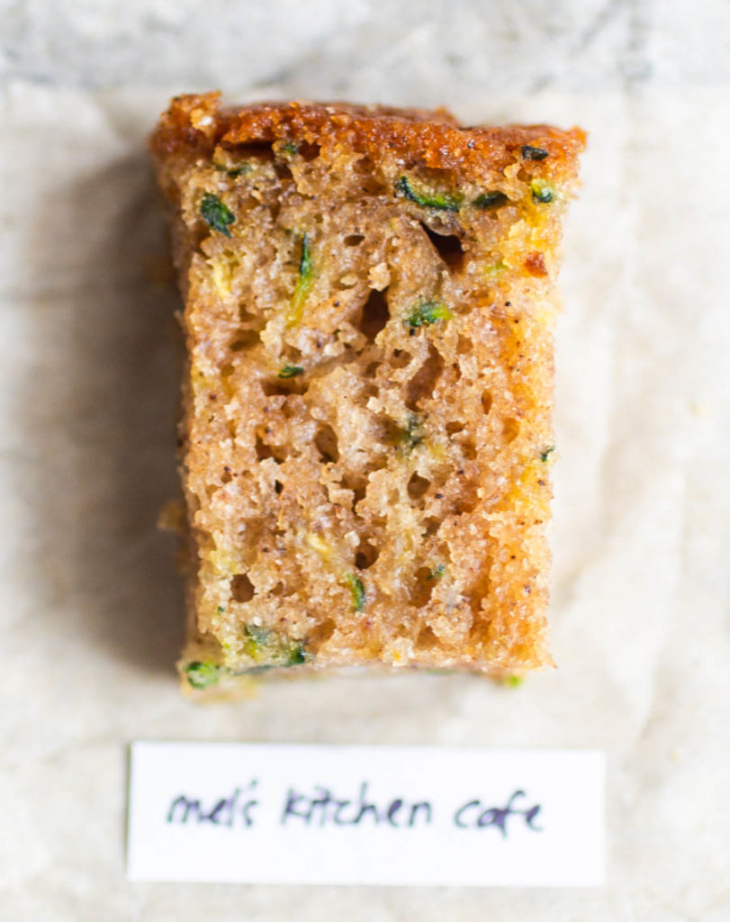 Overhead view of single slice of mel\'s kitchen cafe zucchini bread recipe.