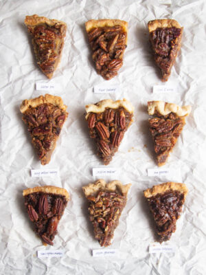 Nine different slices of pecan pie on a white background.