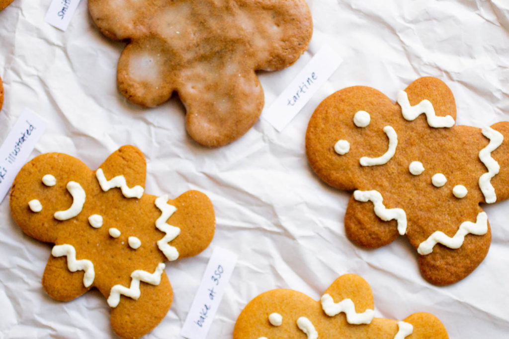 Four different gingerbread cookie men on a white background.