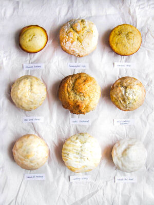 9 different lemon poppy seed muffins on a white background.