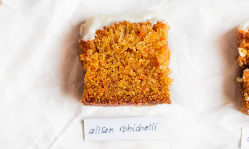 Single slice of Alison Robichelli carrot cake recipe on parchment paper.
