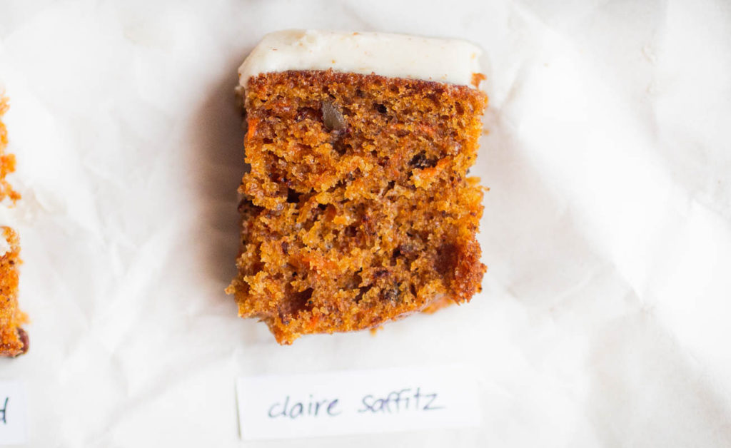 Single slice of claire saffitz carrot cake recipe on parchment paper.