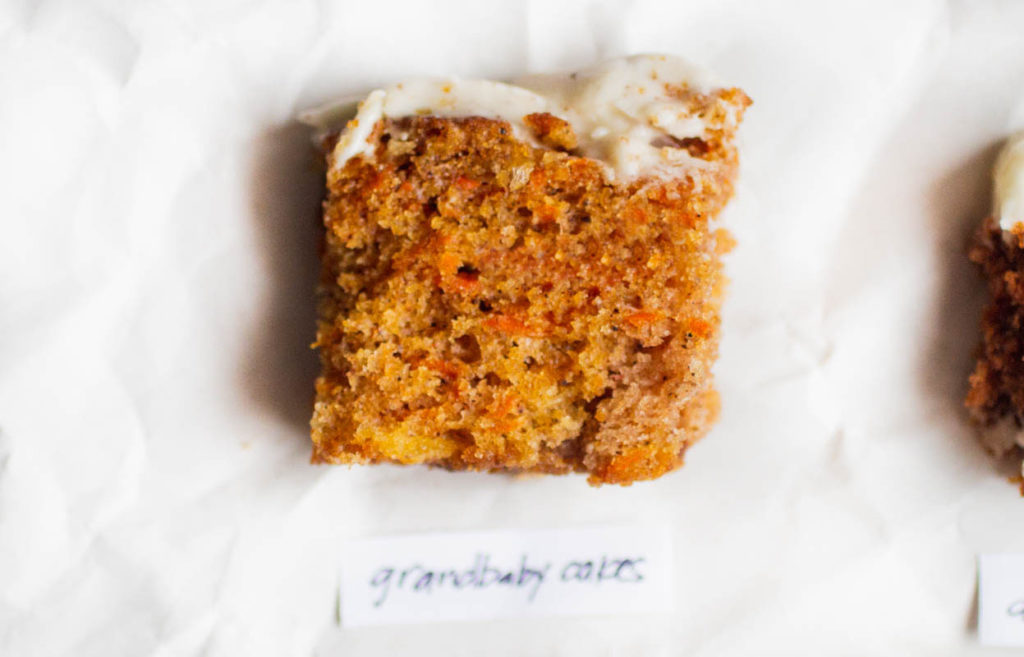 single slice of grandbaby cakes carrot cake on parchment paper.