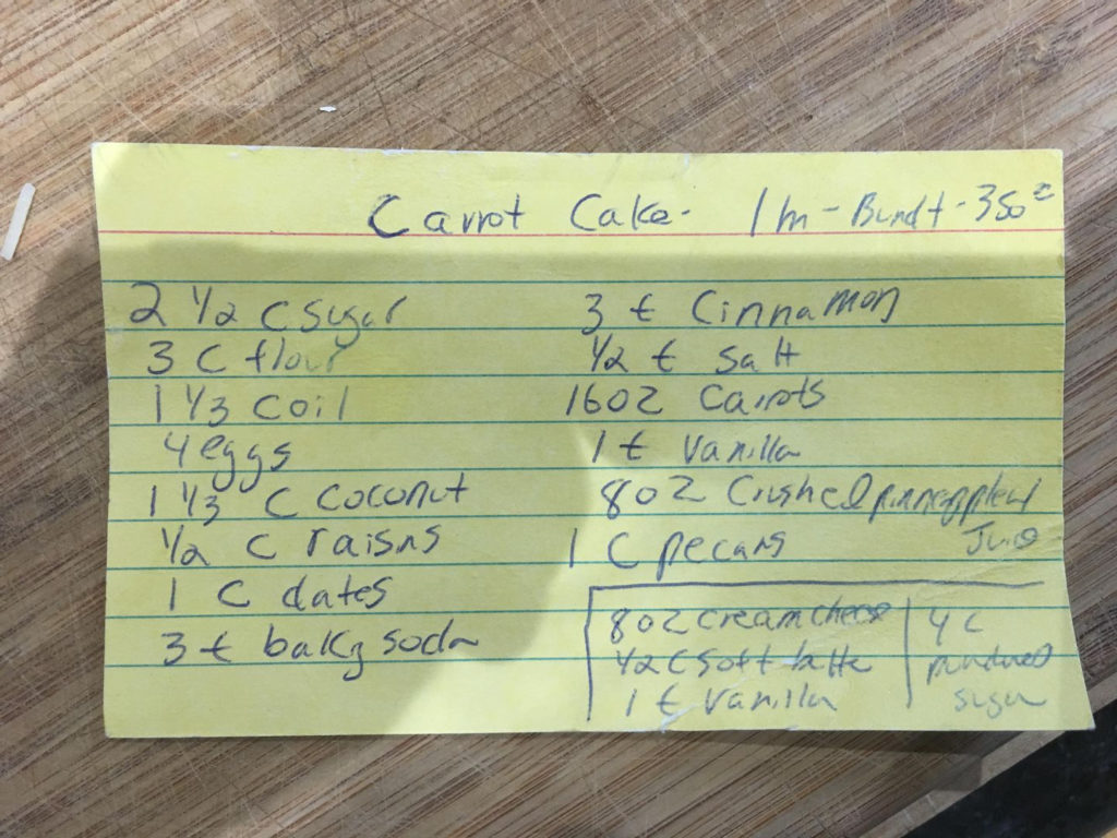 A recipe for carrot cake written on an index card.