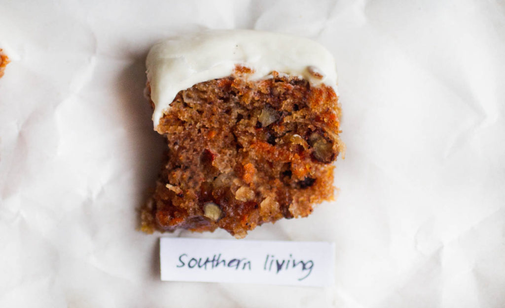Single slice of southern livings carrot cake recipe on parchment paper.