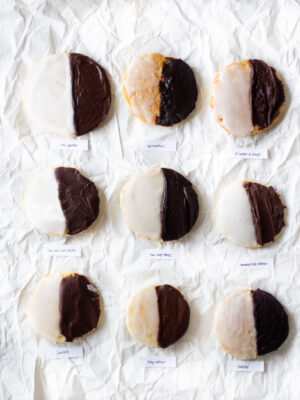 9 black and white cookies on a white background.