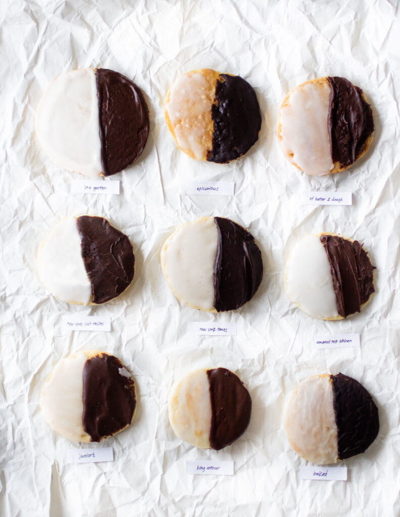 9 black and white cookies on a white background.