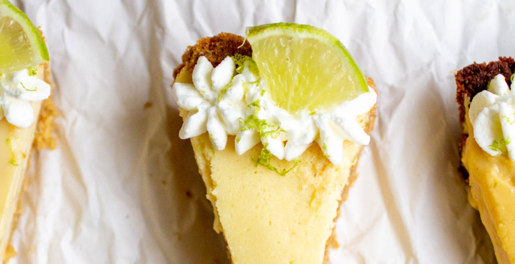 Close up on a slice of key lime pie.