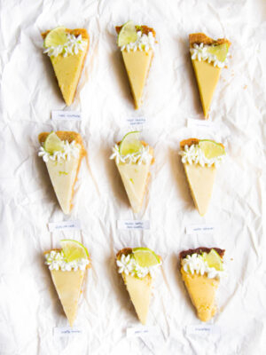 9 different slices of key lime pie on a white background.
