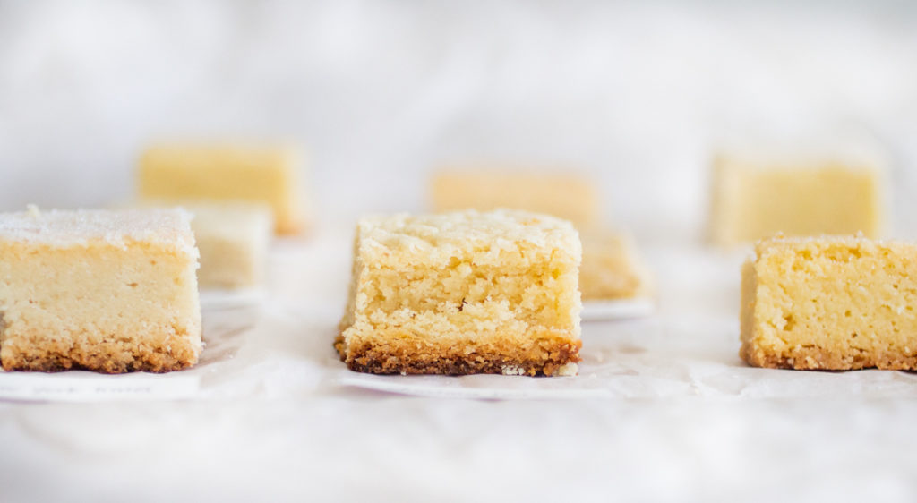 Side view of a thick square of shortbread.