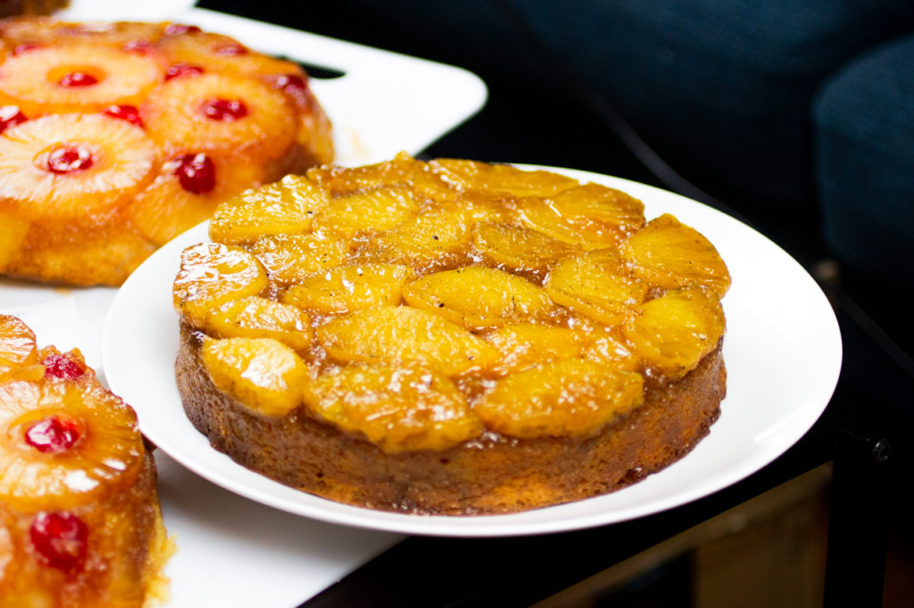 pineapple upside down cake on a white plate.