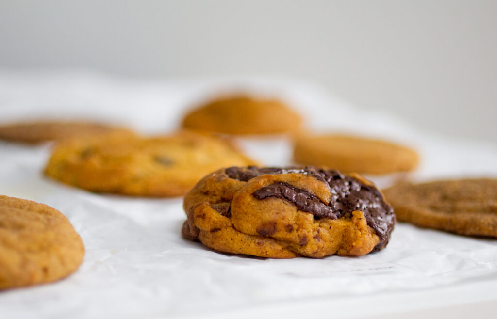 pumpkin cookie with chocolate on a table.
