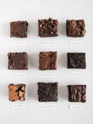 9 vegan brownies on a white background.