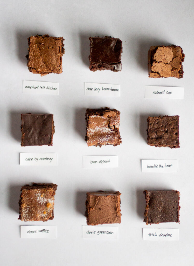 9 squares of flourless chocolate cake on a gray background.