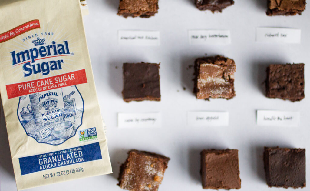 Squares of flourless chocolate cake with a bag of Imperial Sugar.