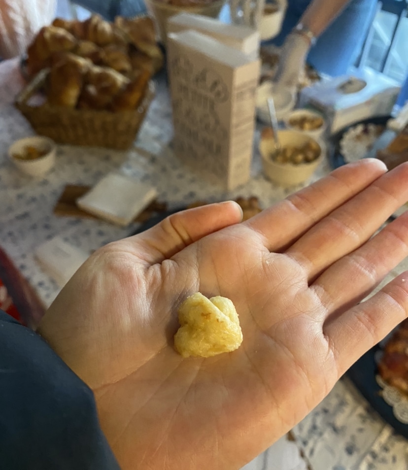 a tiny piece of croissant cereal in the palm of my hand.