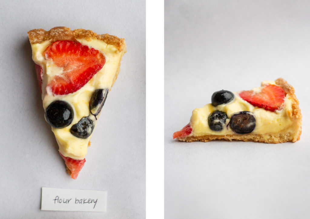 side by side shot of a slice of the flour bakery fruit tart from the top next to the side view.