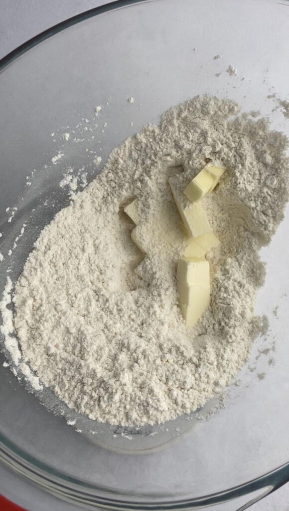Cubed butter in a bowl of flour.