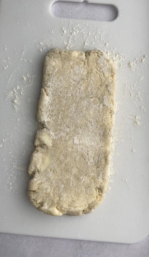 Scone dough rolled out into a rectangle.