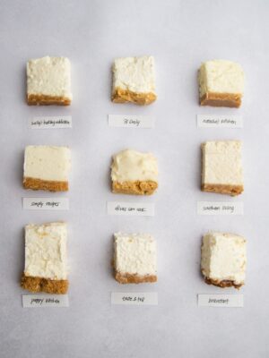 9 squares cheesecake on a gray background.