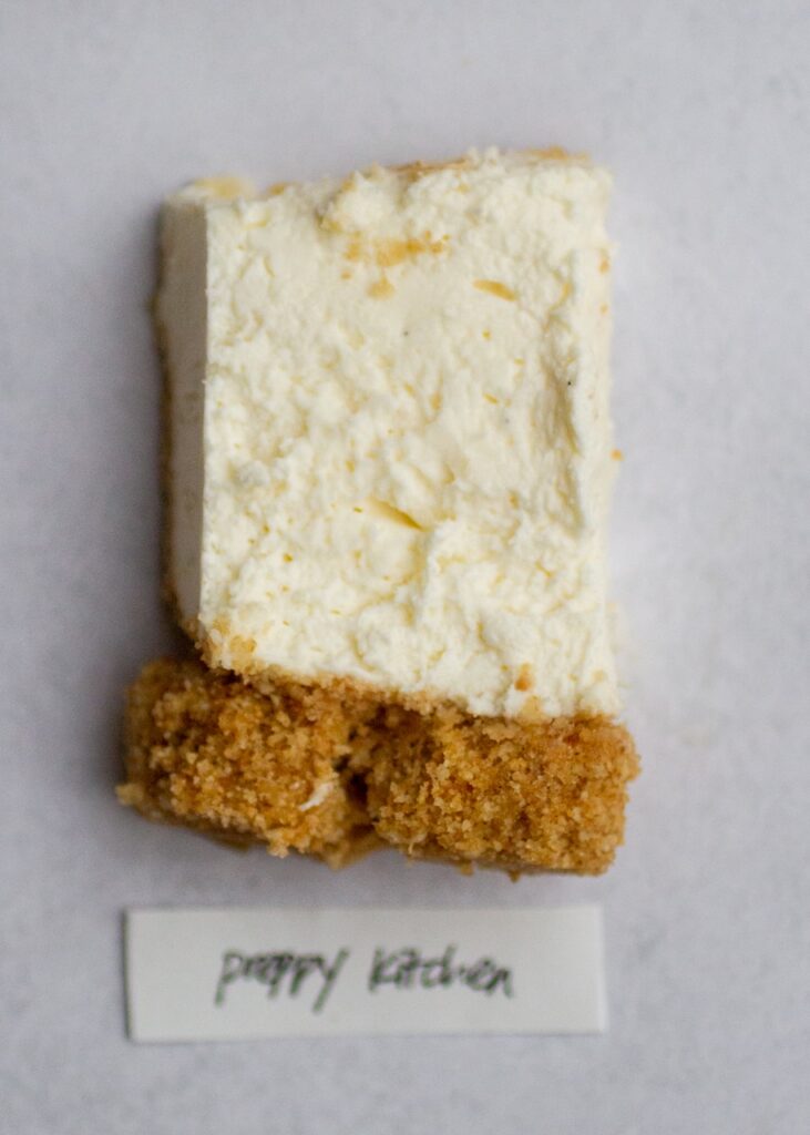 preppy kitchen no-bake cheesecake on a gray background.